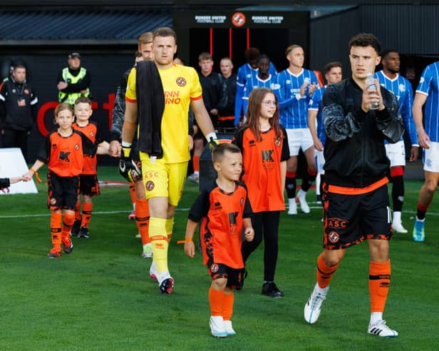  Dundee United's Dylan Tait (R)
