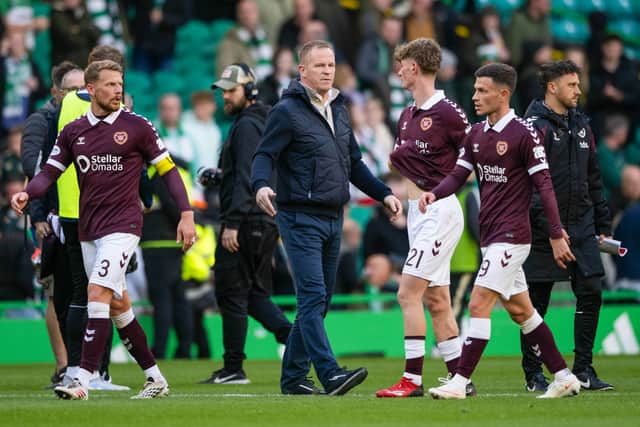 Hearts head coach Wouter Vrancken and his players after the defeat by Celtic.