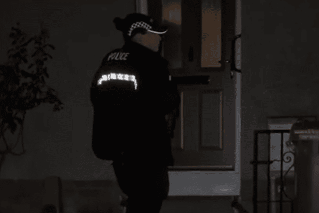 A police officer standing guard outside Stevan McIntosh’s home in North Berwick, East Lothian.