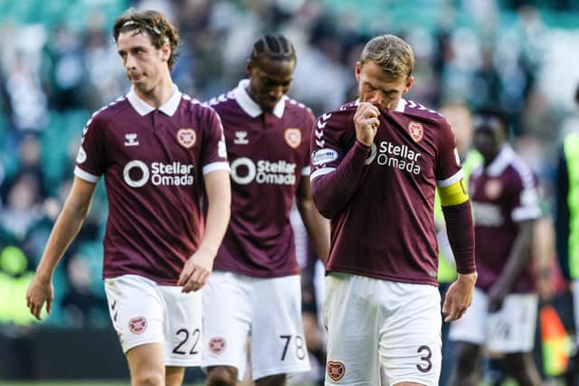 Hearts' Stephen Kingsley (R) at full time after the 7-1 defeat by Celtic. (Photo by Craig Foy / SNS Group)