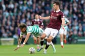 Camilo Duran of Celtic is challenged by Oisin McEntee of Heart of Midlothian