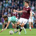 Camilo Duran of Celtic is challenged by Oisin McEntee of Heart of Midlothian