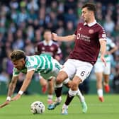 Camilo Duran of Celtic is challenged by Oisin McEntee of Heart of Midlothian