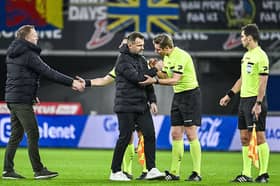 STVV's head coach Wouter Vrancken, Gent's head coach Ivan Leko and referee Lawrence Visser pictured after a soccer match between KAA Gent and STVV