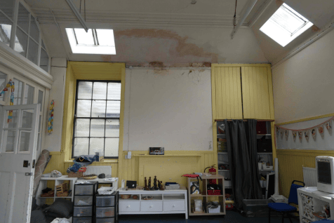 The current church lights at St Margaret's, with damage in the ceiling clearly visible.