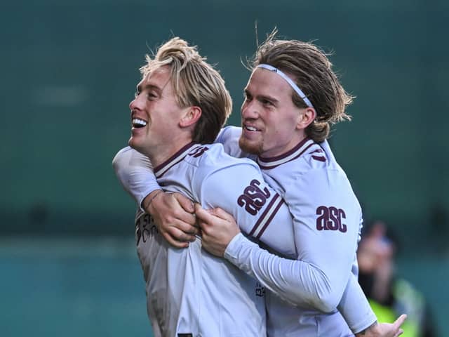 Hearts' Calvin Miller (L) celebrates with Jordi Altena (R) after scoring to make it 2-0 during a William Hill Premiership match between Motherwell and Heart of Midlothian at Fir Park,