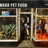 Vandals splashed yellow paint all over the storefront of the pet food shop
