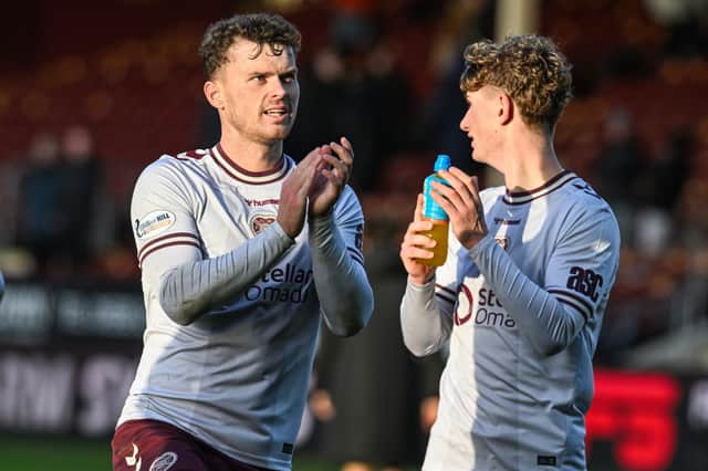 Hearts' Josh McPake (L) and James Wilson (R)