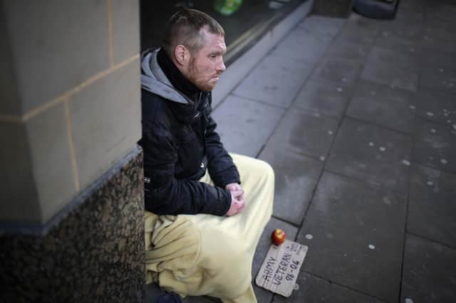 A homeless army veteran begs on the street. Picture: Christopher Furlong/Getty Images