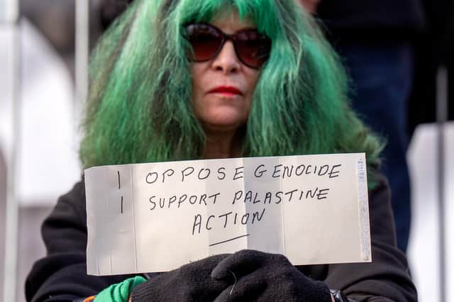 One protester outside the US consulate holds a piece of paper with the offending phrase. Picture: Jane Barlow/PA.