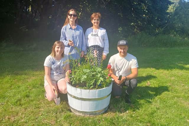 Chair Haleh with gardening volunteers