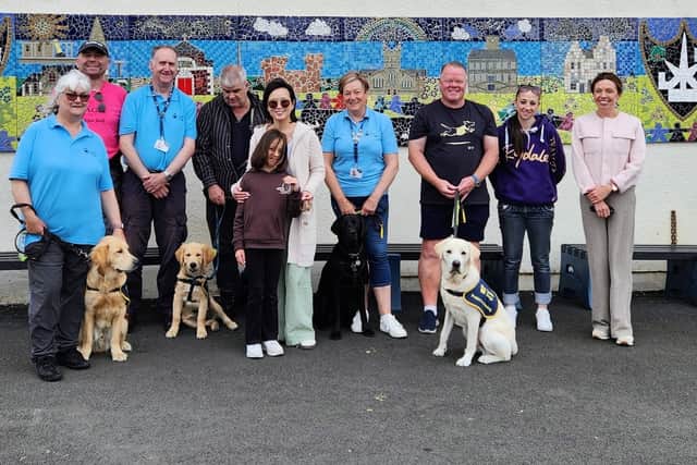 (L- R) Karen Ellis with puppy Wilton; Davie 'deep sea' Paterson; Phil Ellis, Bongo with puppy Kenny, Rikke Hogg with daughter Emily Hogg; Maggie Shaw with dog Owen and Iain Hill with puppy Dale, Carena Schmid and Laura Baillie.