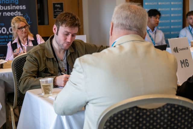 An attendee speaking to a funding provider at a recent FUEL event.