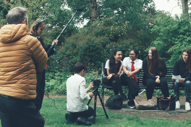 School pupils learning filmmaking skills