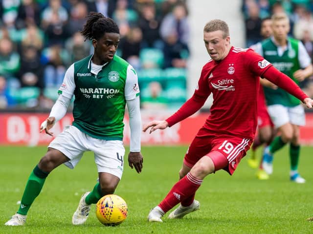 Hibs' Stephane Omeonga tussles with Aberdeen's Lewis Ferguson during a clash between the two teams in May. Pic: SNS