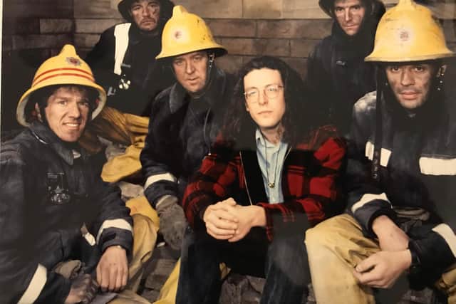 Martin Baptie in 1990, with firemen who rescued him the year before.