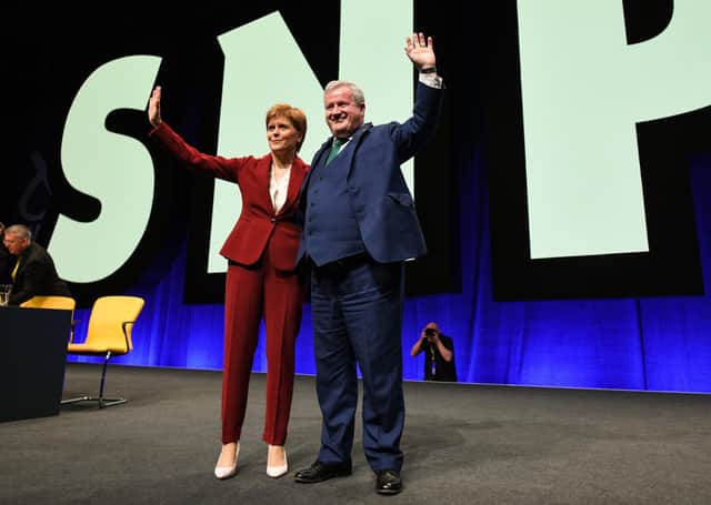 Nicola Sturgeon and Ian Blackford take the plaudits from delegates at the SNP conference (Picture: Jeff J Mitchell/Getty Images)