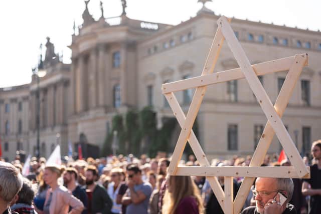 Protesters rally against anti-semitism at Bebelplatz square in the centre of Berlin following the Halle shooting. Picture: AFP/Getty