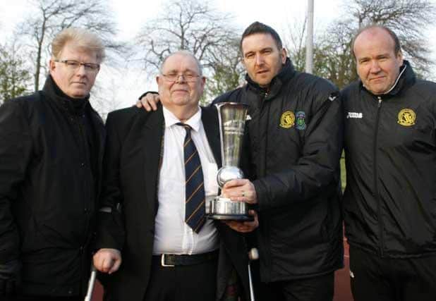 Committee members with Tom Allison, second from left, on winning the East Scotland Premier Division in 2015.