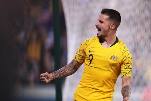 Former Hibs striker Jamie Maclaren celebrates after scoring for his country.