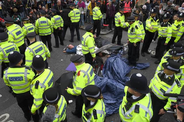 Police controlling Extinction Rebellion protesters in London this week