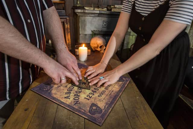 The guests will participate in a seance with a professional medium and Ouija board.