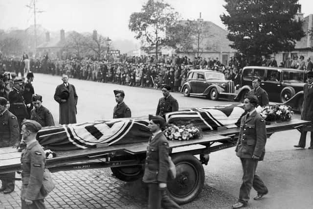 Thousands lined the streets as the coffins of two German soldiers were brought to Portobello Cemetery.