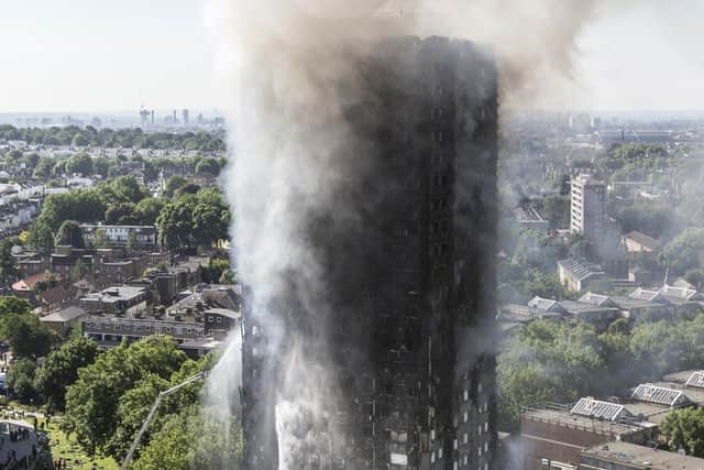 Smoke billows from a fire that has engulfed the 24-storey Grenfell Tower in west London