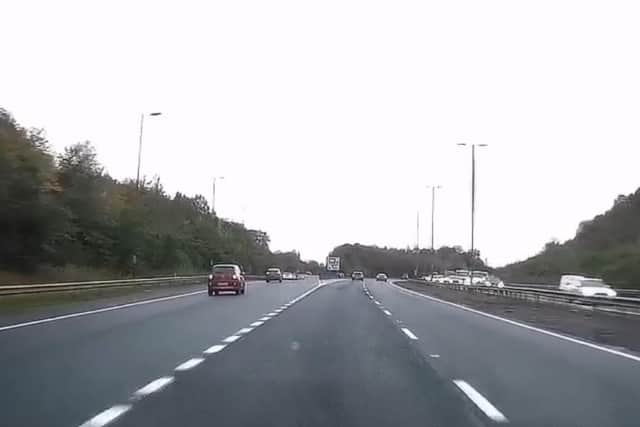 Dash-cam footage shows a motorway driver cutting down a grass bank after missing the turn off. Video and Picture: Phil Hope.
