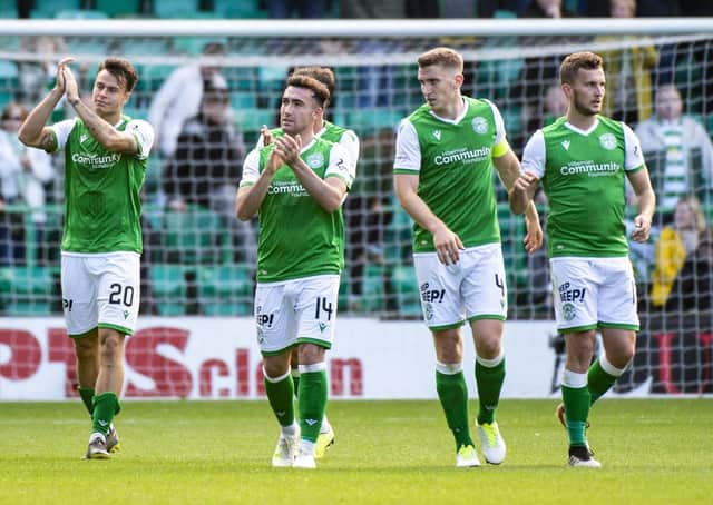 The HIbs players including Stevie Mallan and Paul Hanlon applaud the fans after the Celtic game