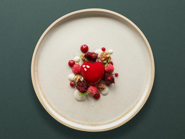 White chocolate mousse, red velvet cake, raspberries, pecan brittle