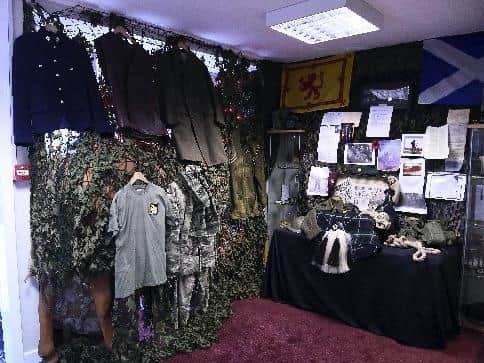 The display includes uniforms loaned by locals.