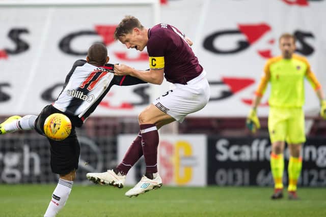 Christophe Berra battles for the ball during the last meeting between the sides at Tynecastle. Picture: SNS