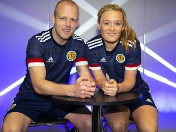 Steven Naismith and Erin Cuthbert show off the new Scotland kits. Picture: SNS