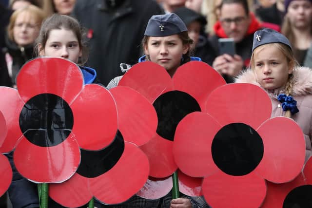 Children take part in a Remembrance event on Sunday.
