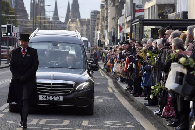 Mourners lined Princes Street as the funeral cortege passed along the street. Pic: Lisa Ferguson