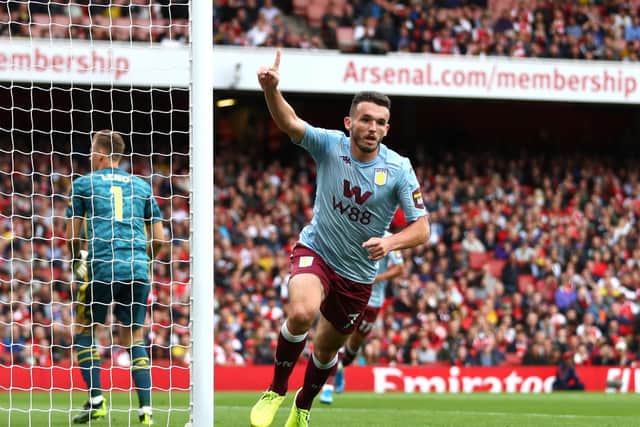 John McGinn celebrates scoring for Aston Villa against Arsenal at the Emirates