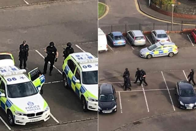 Armed police have been pictured in a car park in Moredun.