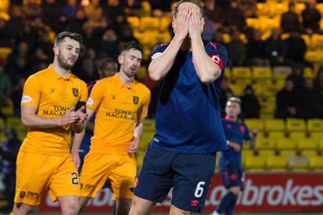 Hearts skipper Christophe Berra reacts after missing a chance in his side's defeat at Livingston last night. Picture: SNS