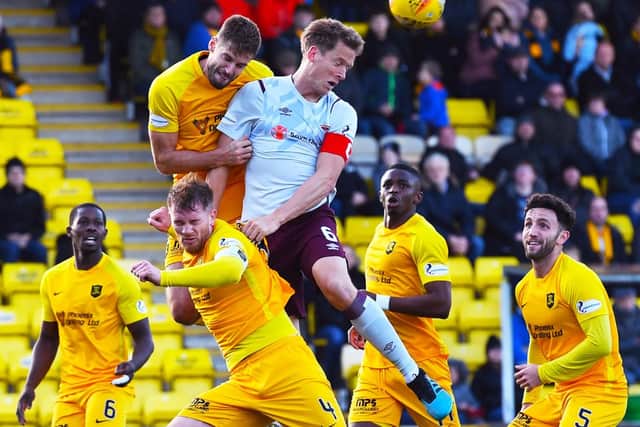Christophe Berra battles for a header during the 0-0 draw with Livingston. Picture: SNS