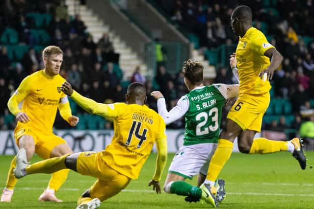 Scott Allan went down under pressure from Marvin Bartley and Hakeem Odoffin. Picture: SNS