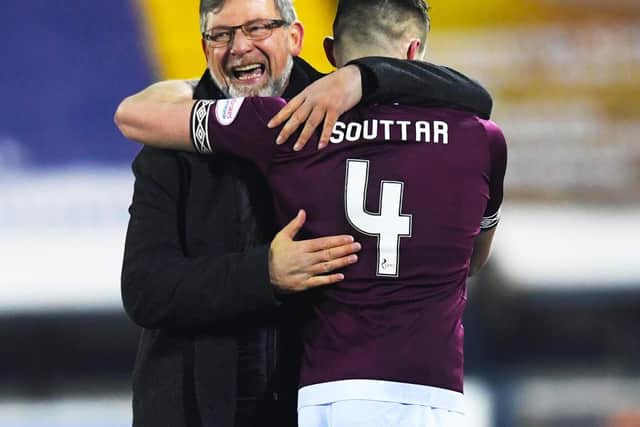 John Souttar and Craig Levein embrace after the 2-1 win over Kilmarnock earlier this year. Picture: SNS