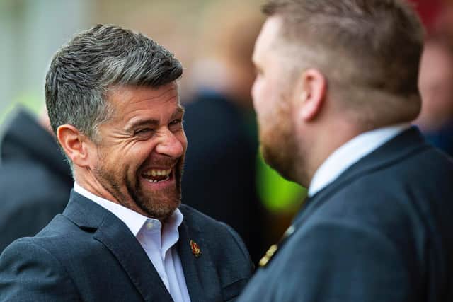 Motherwell boss Stephen Robinson chats with chief executive Alan Burrows before his side's game against Livingston. Picture: SNS