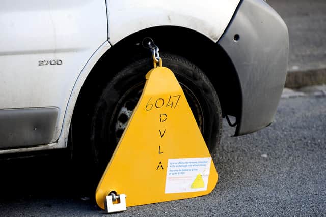 Persistent parking offenders face being clamped or having their car towed away. Picture: Michael Gillen