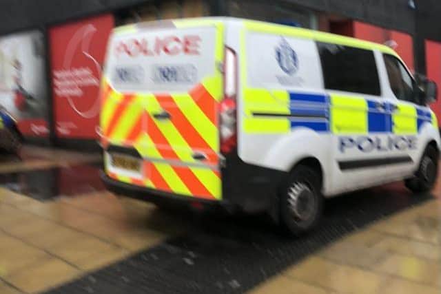 Police were called to the Vodafone shop on the corner of St Andrew Street and Princes Street.