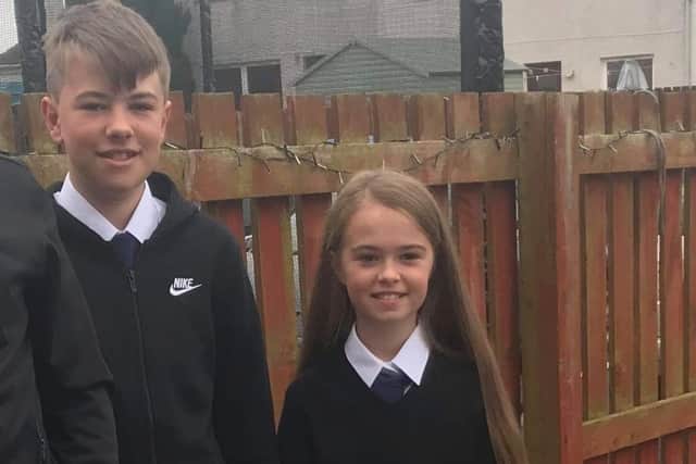 Gary, 14, and Jessica, 12, missed out on the chance to buy a ticket for the dance. Picture: Stephanie Scott.