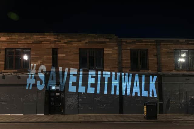 Save Leith Walk campaigners have won a battle to stop the demolition of the parade of shops.