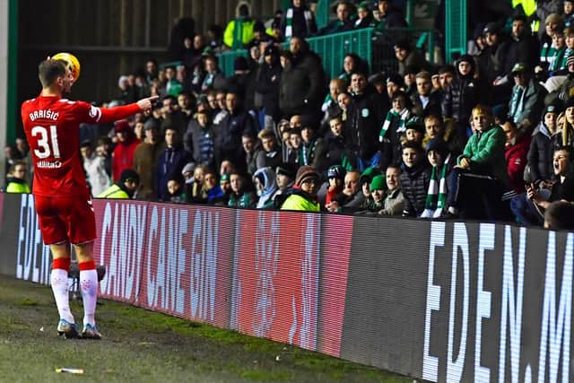 Rangers defender Borna Barisic confronts a Hibs fan during Friday's game. Picture: SNS
