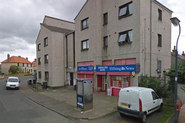 Detectivesare hunting a blade bandit who failed to hold-up a Dalkeith store on New Years Day. Pic: Google Street View.