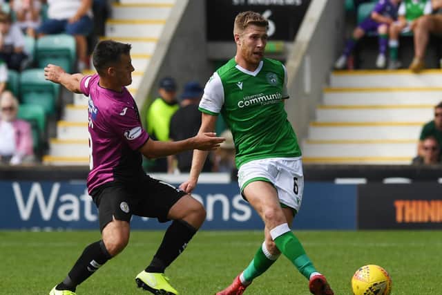 Josh Vela, right, and Kyle Magennis tussle for the ball during Hibs' 1-0 win over St Mirren earlier in the season. Picture: SNS